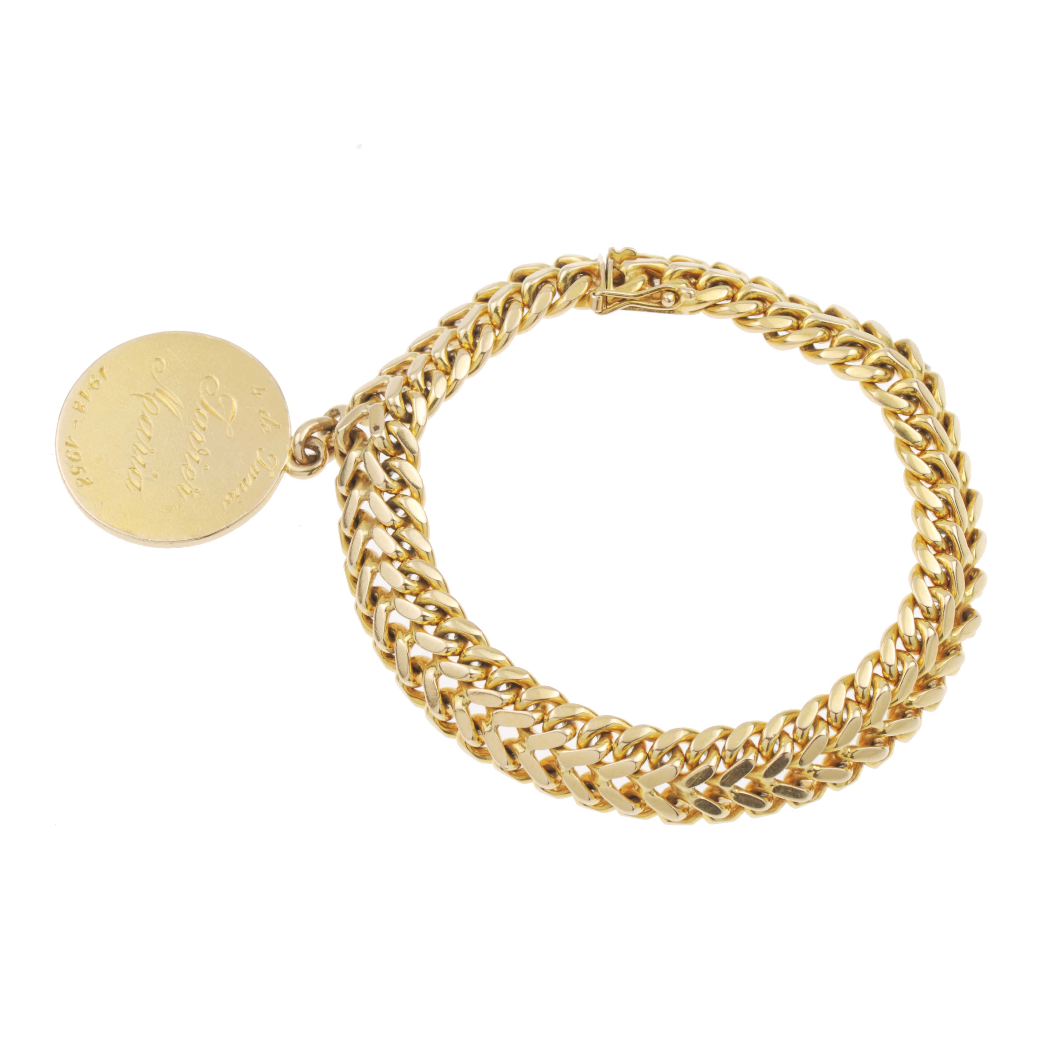 PULSERA TRENZADA CON MEDALLA EN ORO.