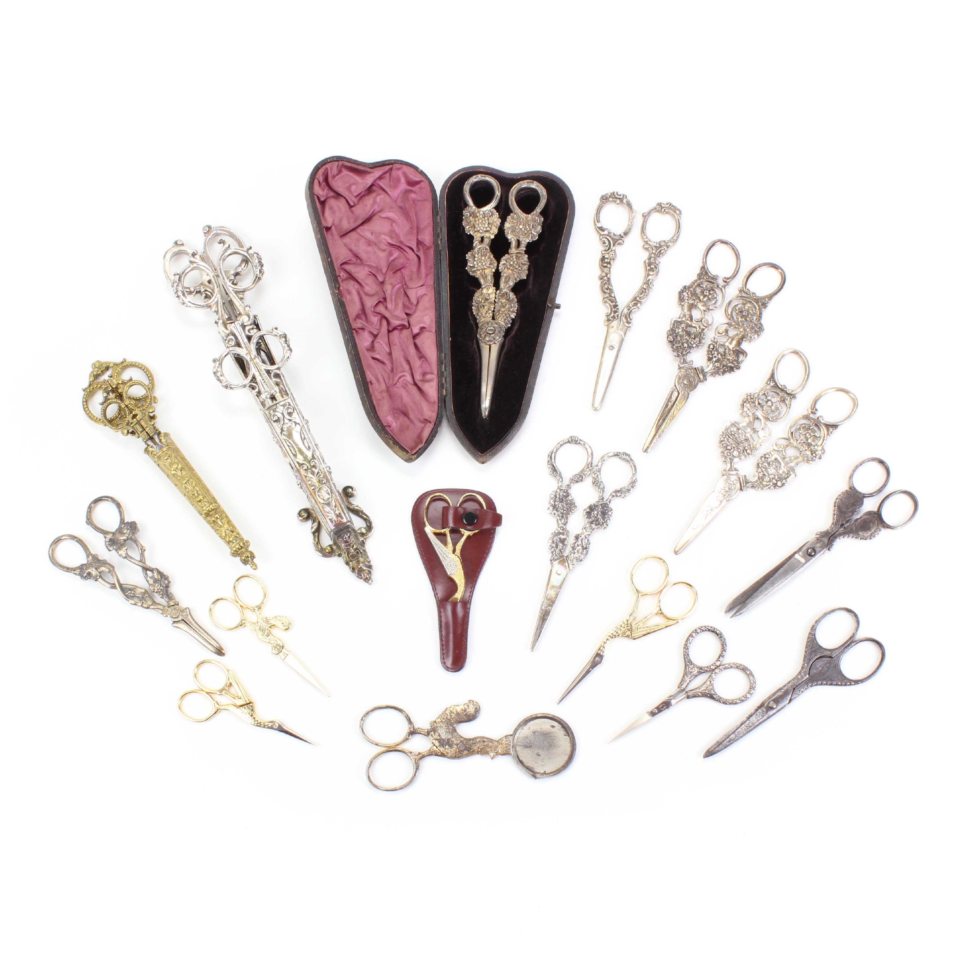 LOT OF FIFTEEN PAIRS OF SCISSORS AND A CIGAR CUTTER, C19th.