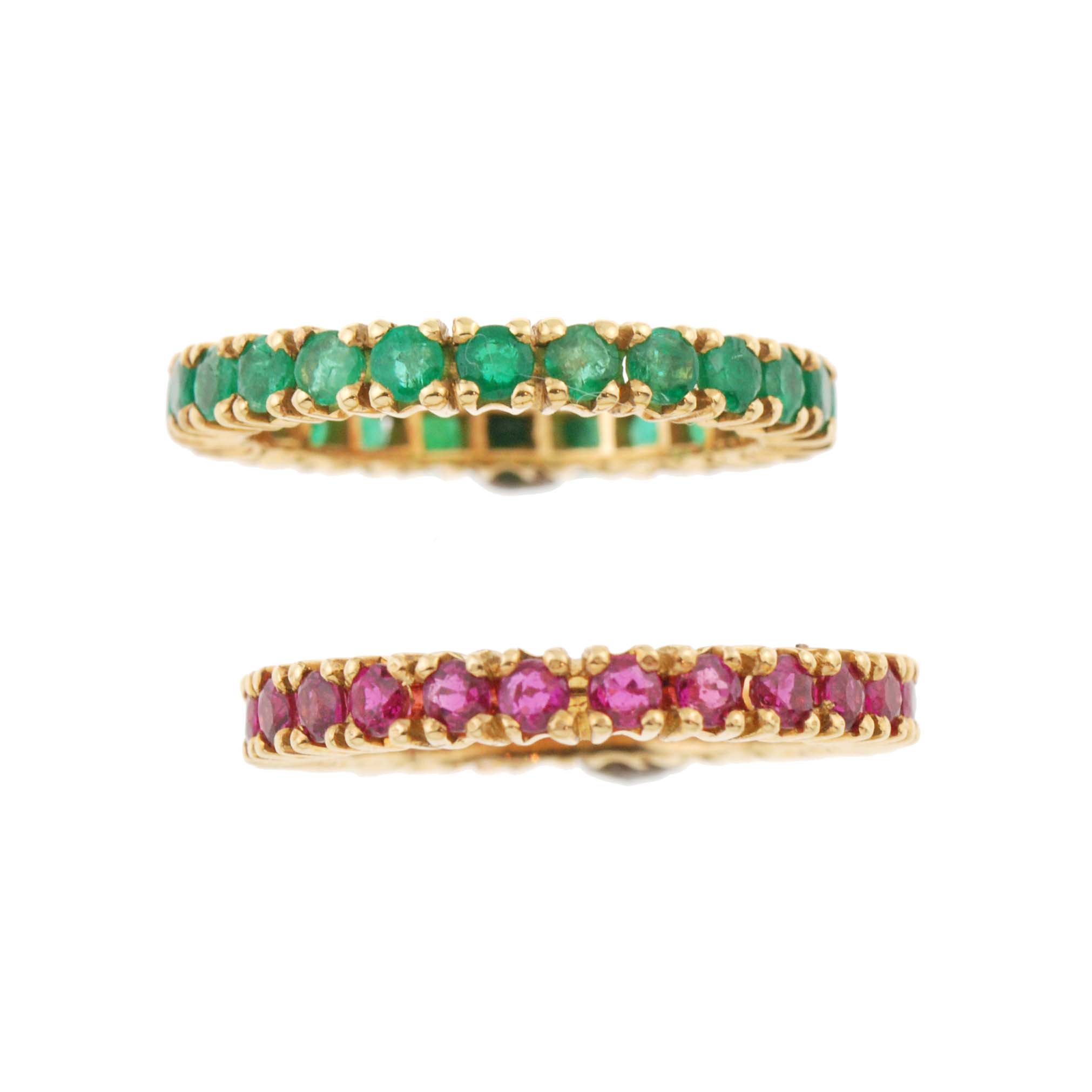 TWO RUBY AND EMERALD WEDDING RINGS. 