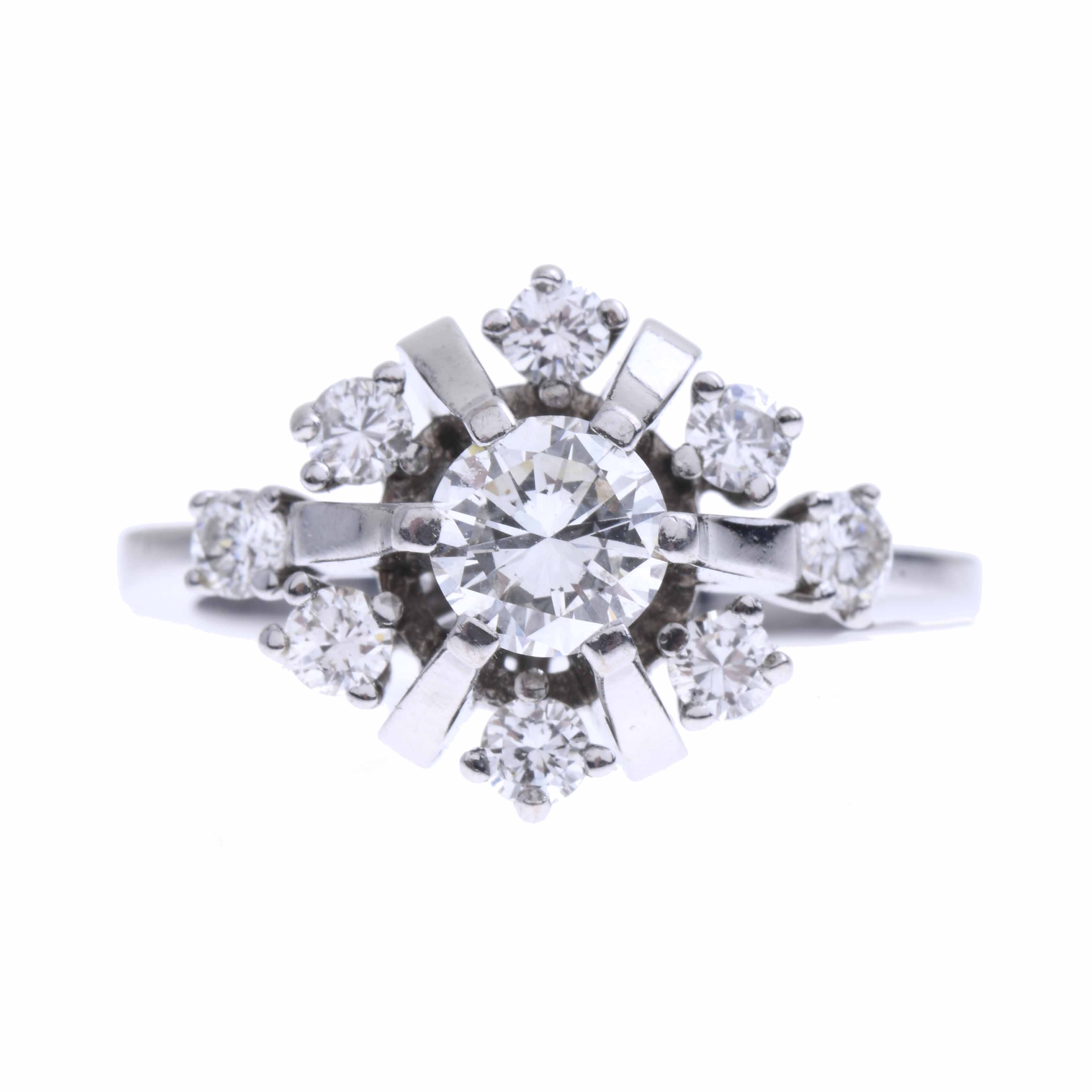 WHITE GOLD AND DIAMONDS ROSETTE RING.