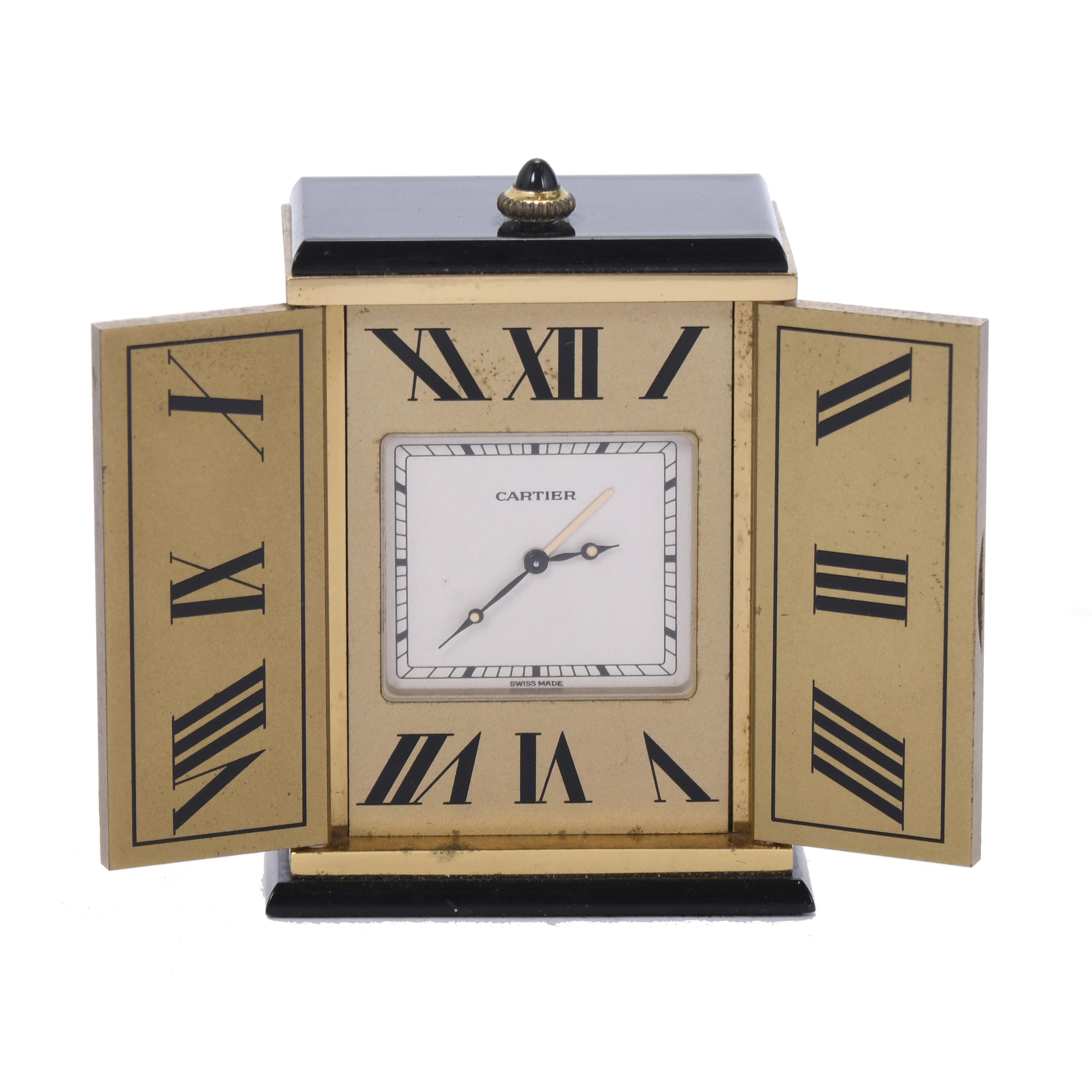 CARTIER. SMALL TABLE ALARM CLOCK. 20TH CENTURY. 