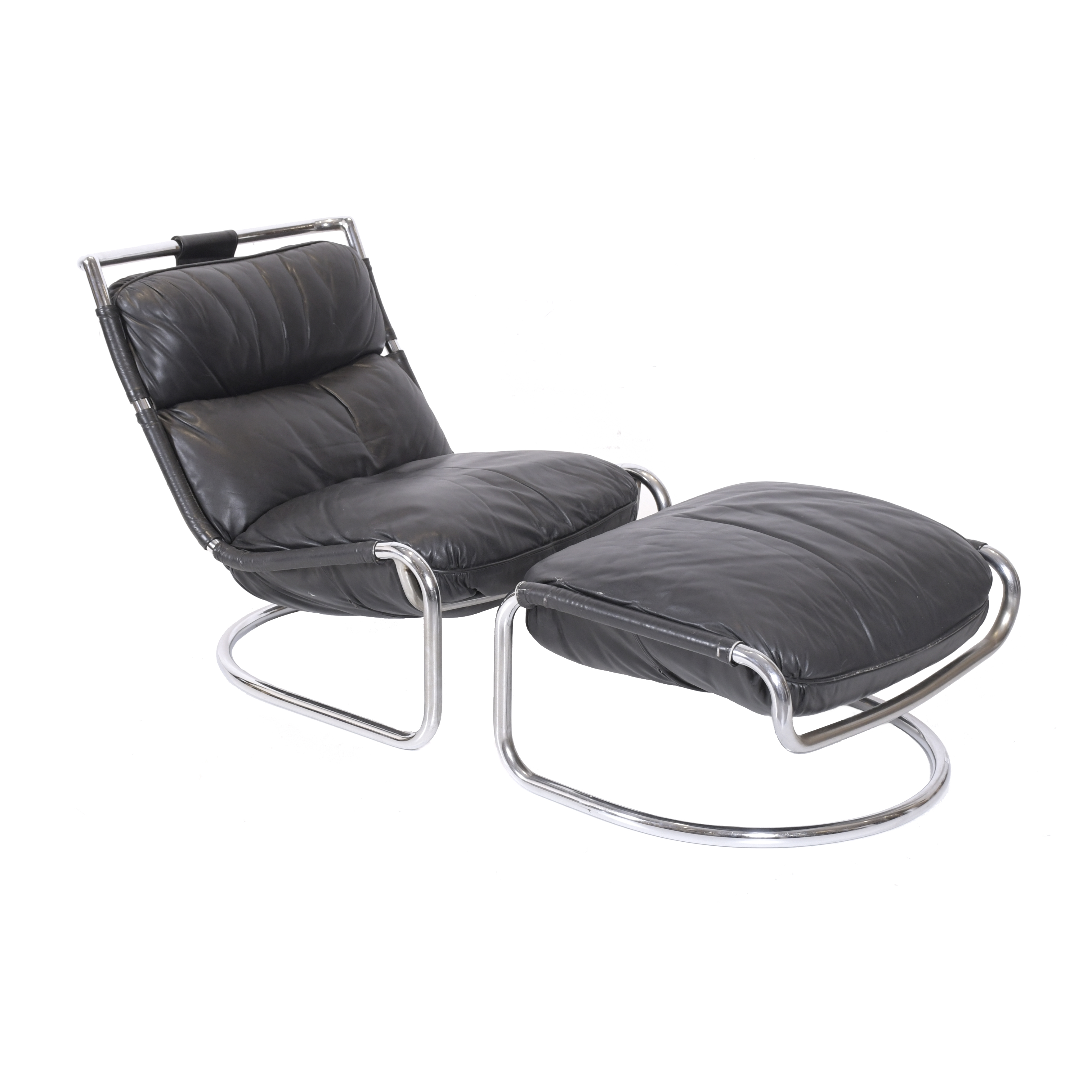 AFTER MODELS BY GAE AULENTI (1927-2012). LEATHER ARMCHAIR W