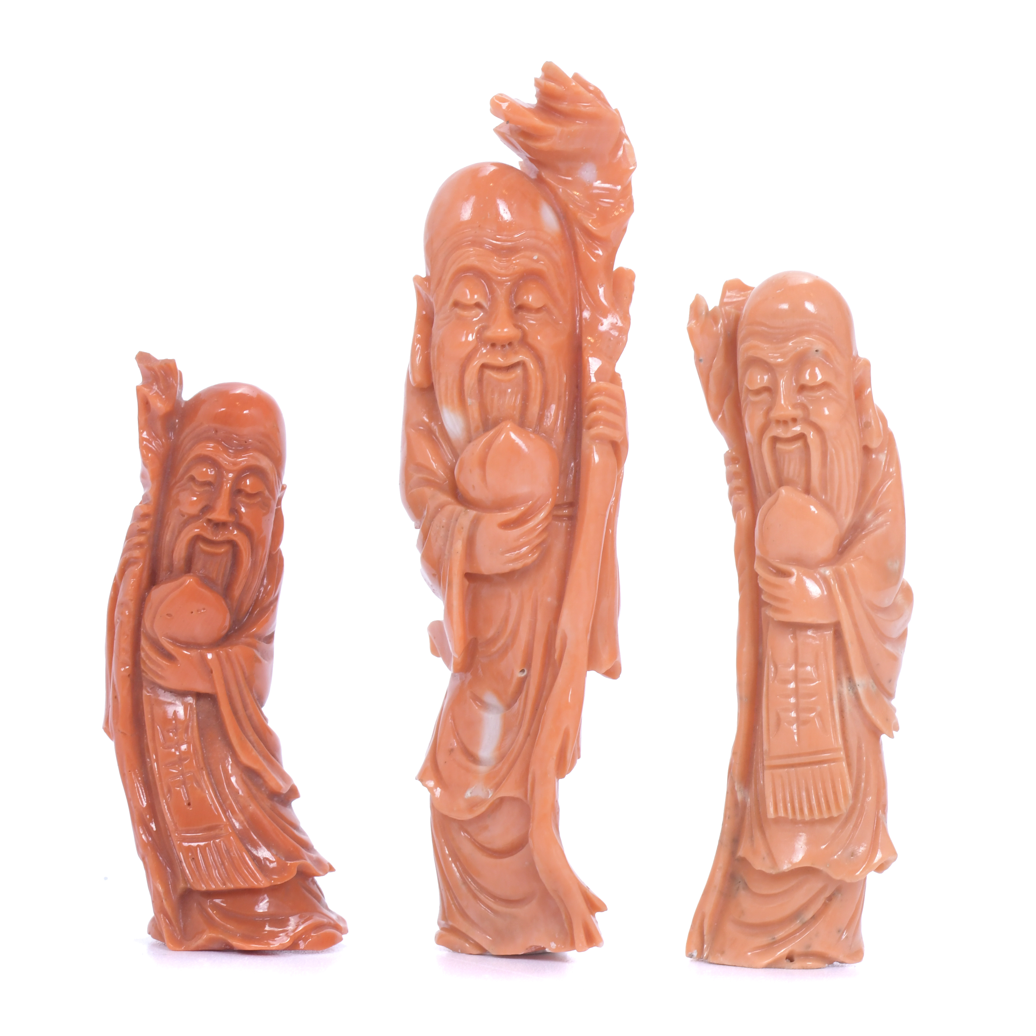 20TH CENTURY CHINESE SCHOOL. THREE SMALL FIGURES IN CORAL.