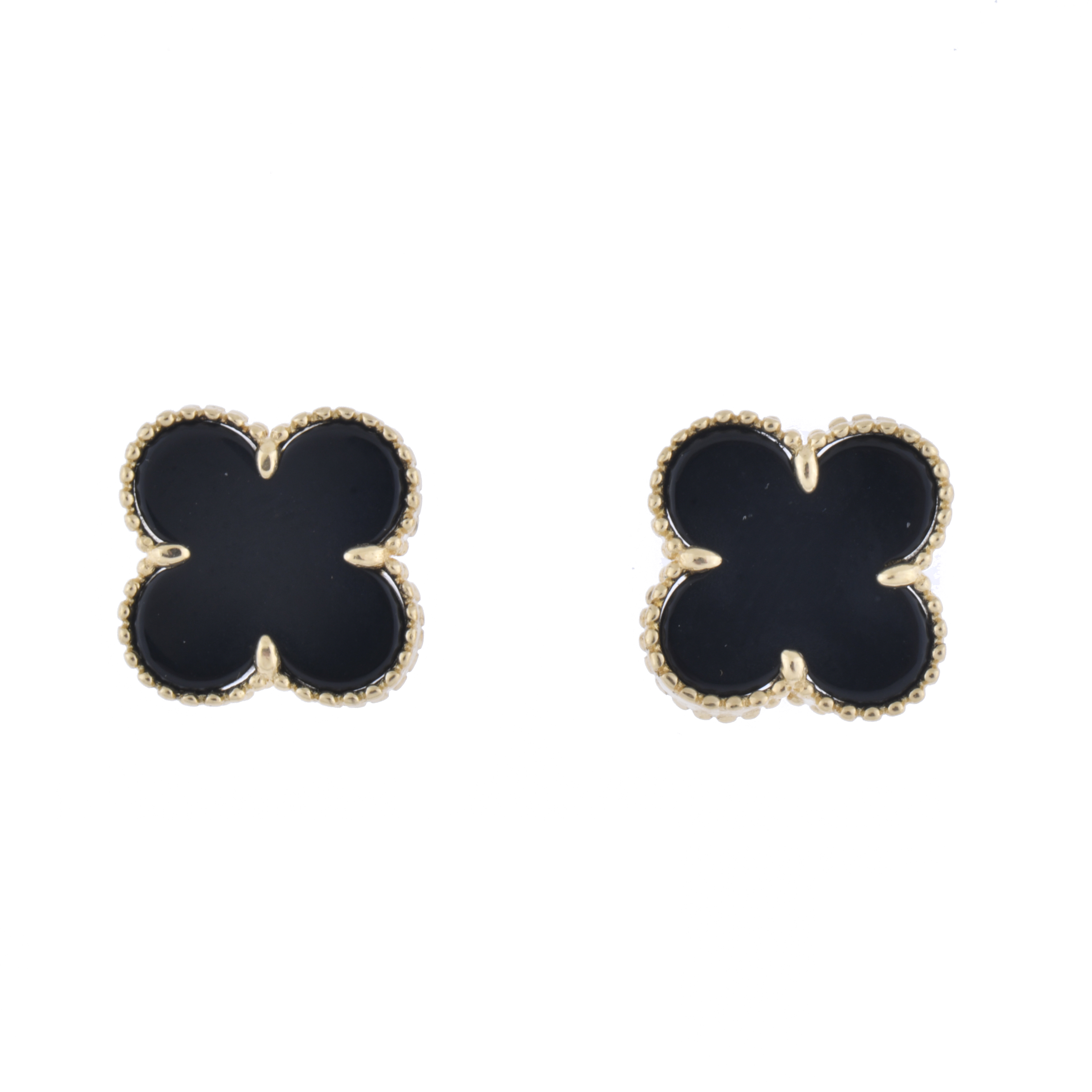 After VAN CLEEF models. "Alhambra" earrings.