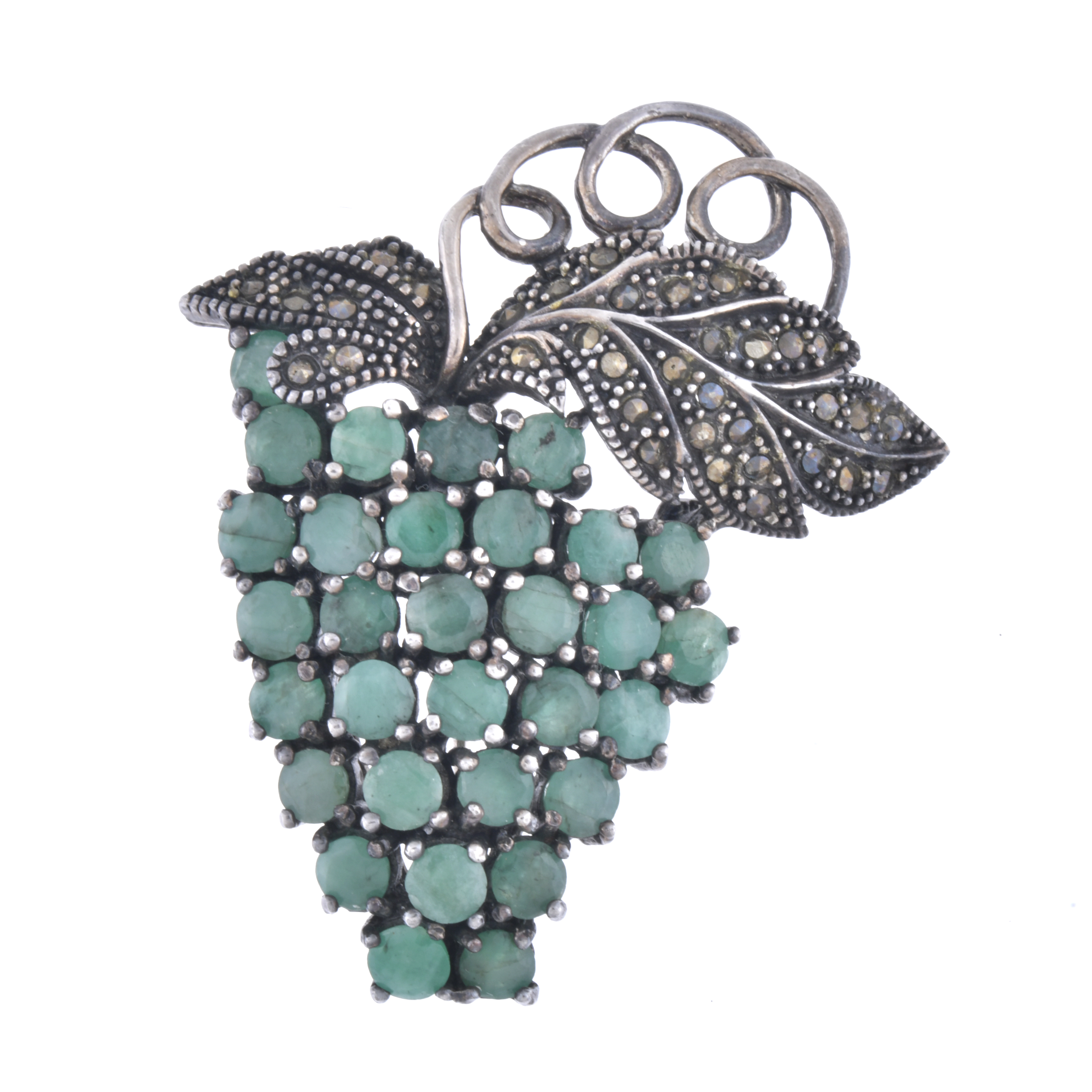 Cluster-shaped silver brooch with natural emeralds.