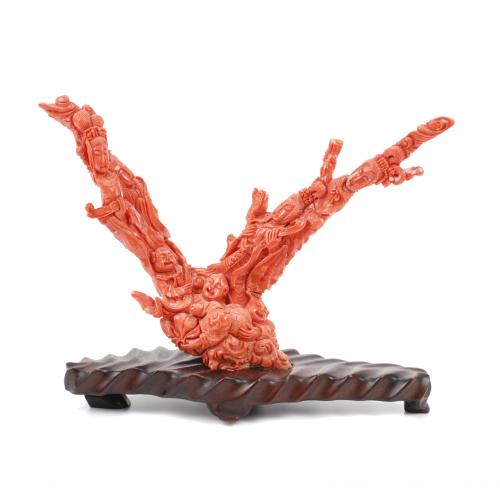 Made from natural red coral, with wooden stand. Small restoration.919 gr in total.20cm H without the stand.