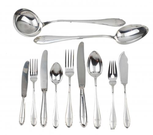 Hallmarked, engraved with the innitials M.S.S.It comprises 130 table cutlery items and 2 serving spoons.Total 132 pieces.5,040 kgs. of weight, without knives.