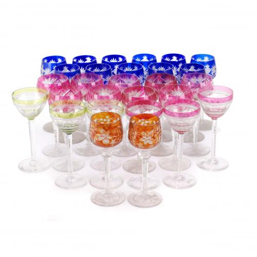 Cut glass. 11 blue glasses, two orange, three gree, nine pink, three red. One glass with small crack.20 cms. high (the largest).