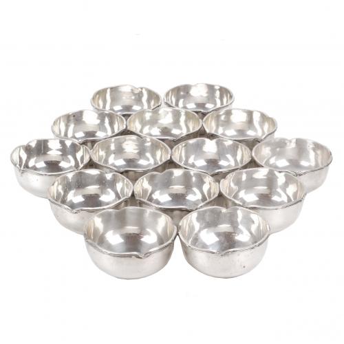 SET OF FOURTEEN EGYPTIAN SILVER FINGER-BOWLS.