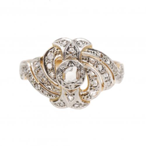 Gold and platinum with rose-cut diamons of an approx. weight of 0,42 ct.Ring size 20 mm.54 gr.