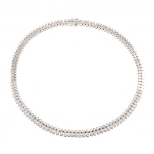 Double white gold string with brilliant-cut diamonds in flush setting, approx. weight of 5 ct. 75,1 gr.