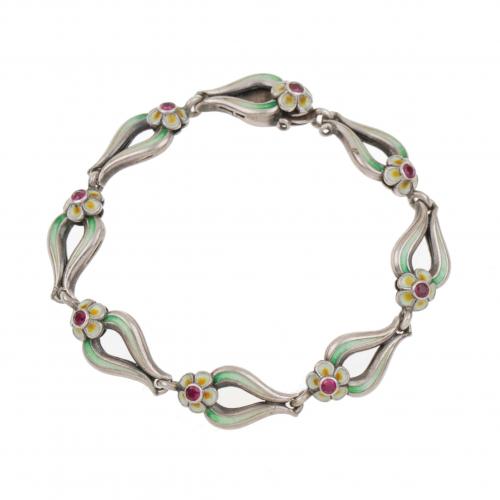 Silver links enameled with floral decoration and round-cut rubys.15,4 gr.