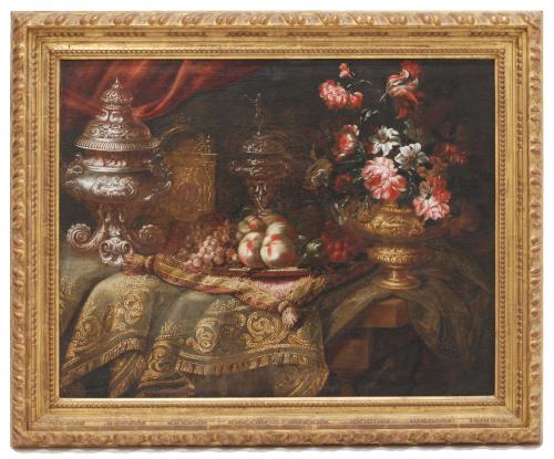 Oil on canvas.A pantry with grapes, peaches and flowers on an embroided rug and cushion. The painting has been previously auctioned by Sotheby's in 2008.73 x 92 cm. y 92,5 x 111,5 cm. (frame). 