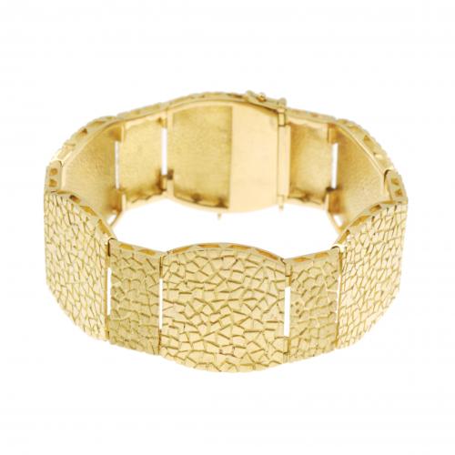 PULSERA ANCHA EN ORO.