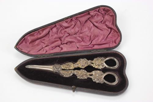 LOT OF FIFTEEN PAIRS OF SCISSORS AND A CIGAR CUTTER, C19th.