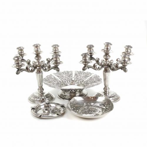 PAIR OF SPANISH SILVER CANDELABRA AND THREE CENTREPIECES, MID 20TH CENTURY.