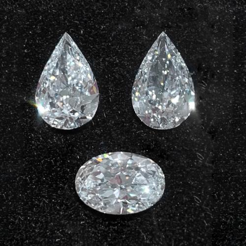 THREE UNMOUNTED DIAMONDS.