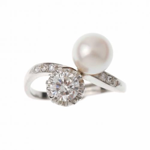 YOU AND ME RING WITH A PEARL AND A DIAMOND.