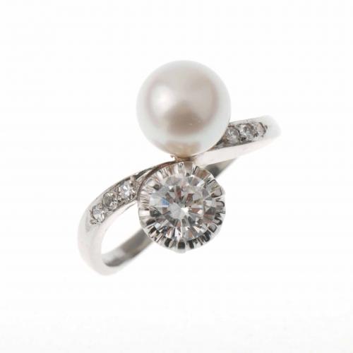 YOU AND ME RING WITH A PEARL AND A DIAMOND.