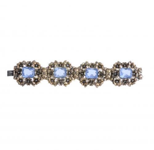 PULSERA ARTICULADA EN PLATA Y PIEDRAS AZULES.