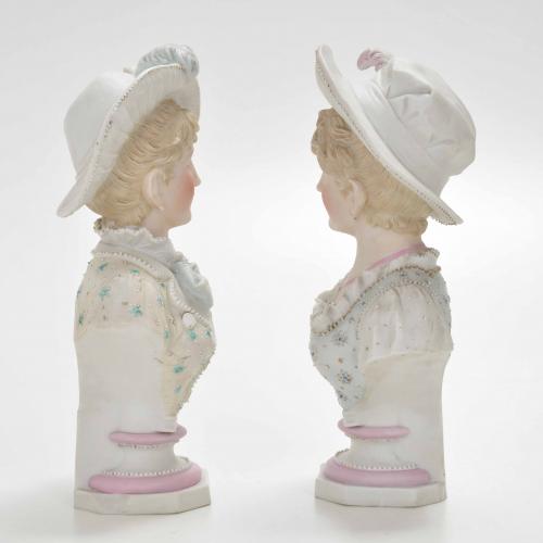 "GIRLS", PAIR OF SÉVRES-STYLE FRENCH BUSTS.