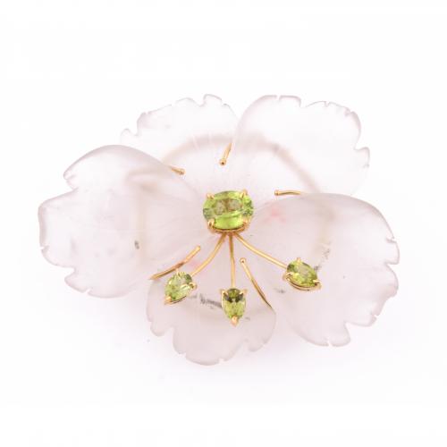 FLOWER BROOCH IN MATT ROCK CRYSTAL QUARTZ AND PERIDOTS.