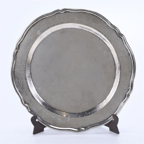 PERUVIAN PLATTER AND FOUR ROUND TRAYS IN SILVER, SECOND HAL