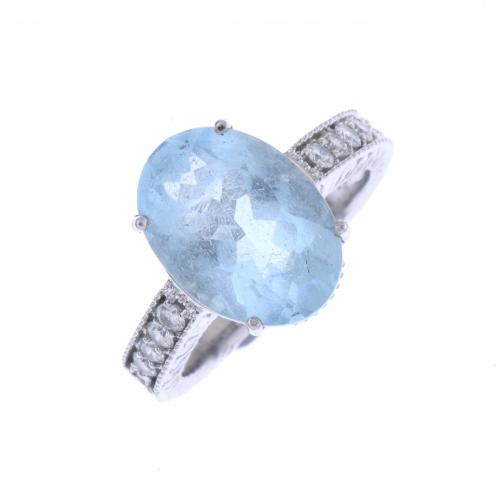 WHITE GOLD RING WITH BLUE TOPAZ.