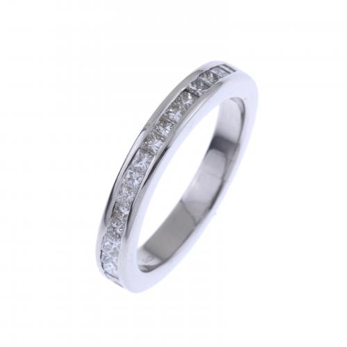 HALF WEDDING RING IN PLATINUM WITH DIAMONDS.