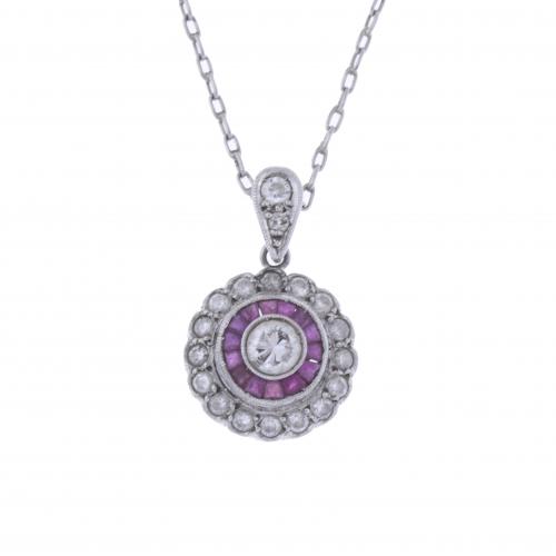 CHAIN WITH PENDANT IN PLATINUM, DIAMONDS AND RUBIES.