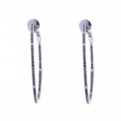 CREOLE EARRINGS WITH BLACK AND WHITE DIAMONDS.