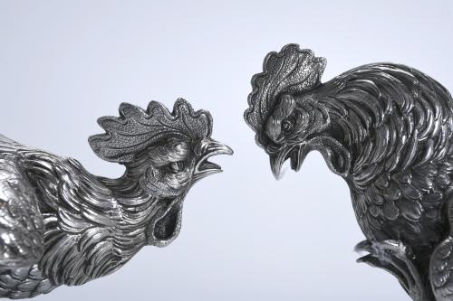 TWO SPANISH SILVER ROOSTERS, MID 20TH CENTURY.