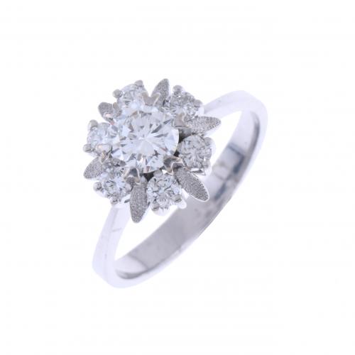 SOLITAIRE RING, BORDERED WITH DIAMONDS.