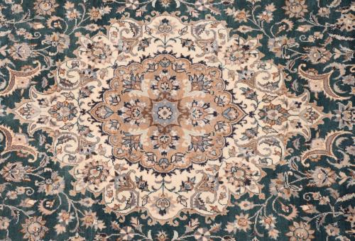 IRANIAN GREEN AND OCHRE CARPET, 20TH CENTURY. 