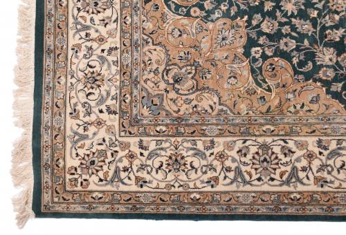 IRANIAN GREEN AND OCHRE CARPET, 20TH CENTURY. 