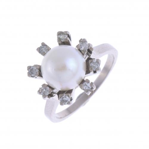 DIAMONDS AND PEARL ROSETTE RING.