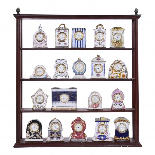 COLLECTION OF NINETEEN SMALL PORCELAIN TABLE CLOCKS, 20TH CENTURY