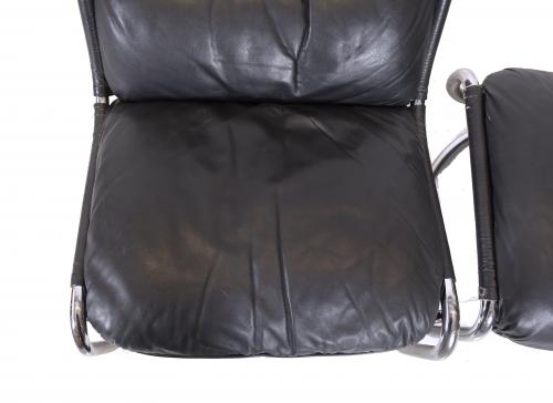 AFTER MODELS BY GAE AULENTI (1927-2012). LEATHER ARMCHAIR W