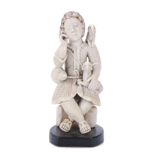 INDO-PORTUGUESE FIGURE "THE GOOD SHEPHERD" IN IVORY, 19TH CENTURY.