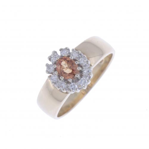 ROSETTE RING WITH ORANGE SAPPHIRE AND DIAMONDS.