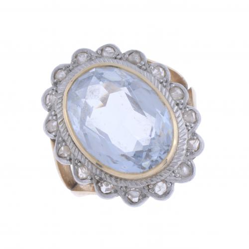 LARGE ROSETTE RING WITH BLUE TOPAZ .