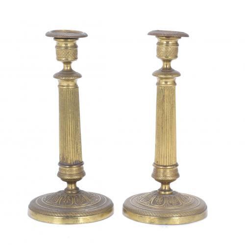 PAIR OF CHARLES X PERIOD GILDED BRONZE CANDLESTICKS.