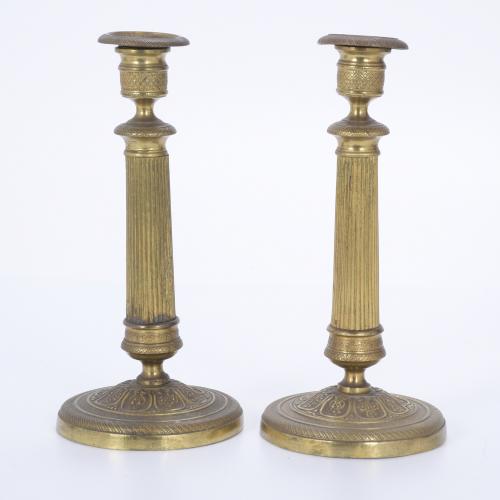 PAIR OF CHARLES X PERIOD GILDED BRONZE CANDLESTICKS.