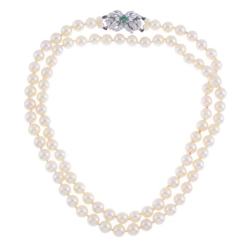 PEARLS LONG NECKLACE WITH DIAMONDS AND EMERALD CLASP.