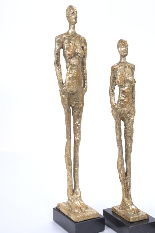 THREE FIGURES AFTER MODELS BY GIACOMETTI.