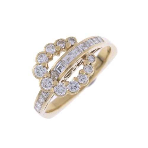 HORSESHOE-SHAPED DIAMONDS RING.