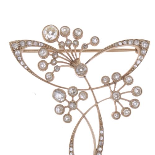 BROCHE MODERNISTA CON DIAMANTES.