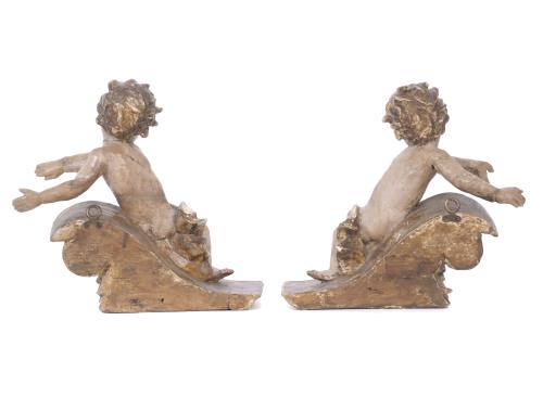 PAIR OF CRESTS WITH FIGURES OF ANGELS, 19TH CENTURY.