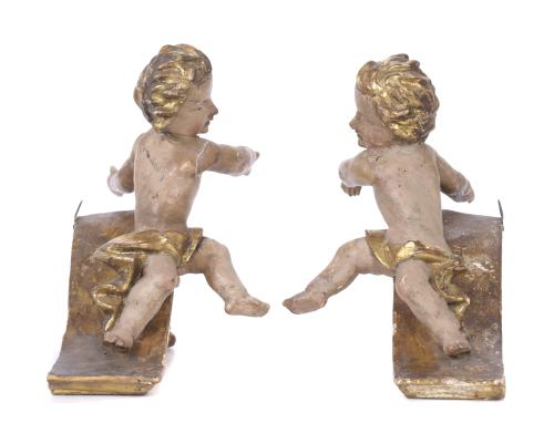 PAIR OF CRESTS WITH FIGURES OF ANGELS, 19TH CENTURY.