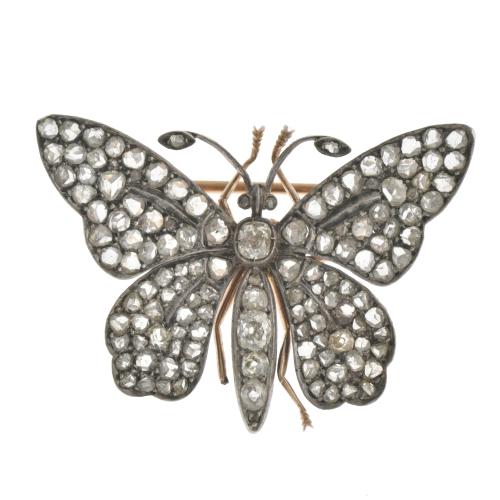 Butterfly-shaped brooch with diamonds.